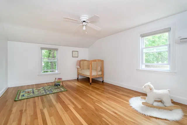 a room with a bed and window