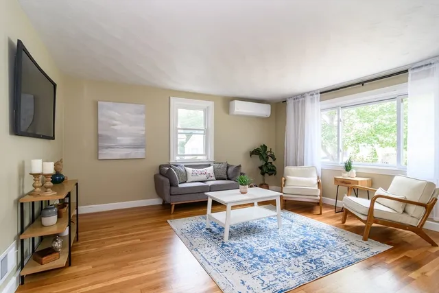 a living room with furniture and a rug