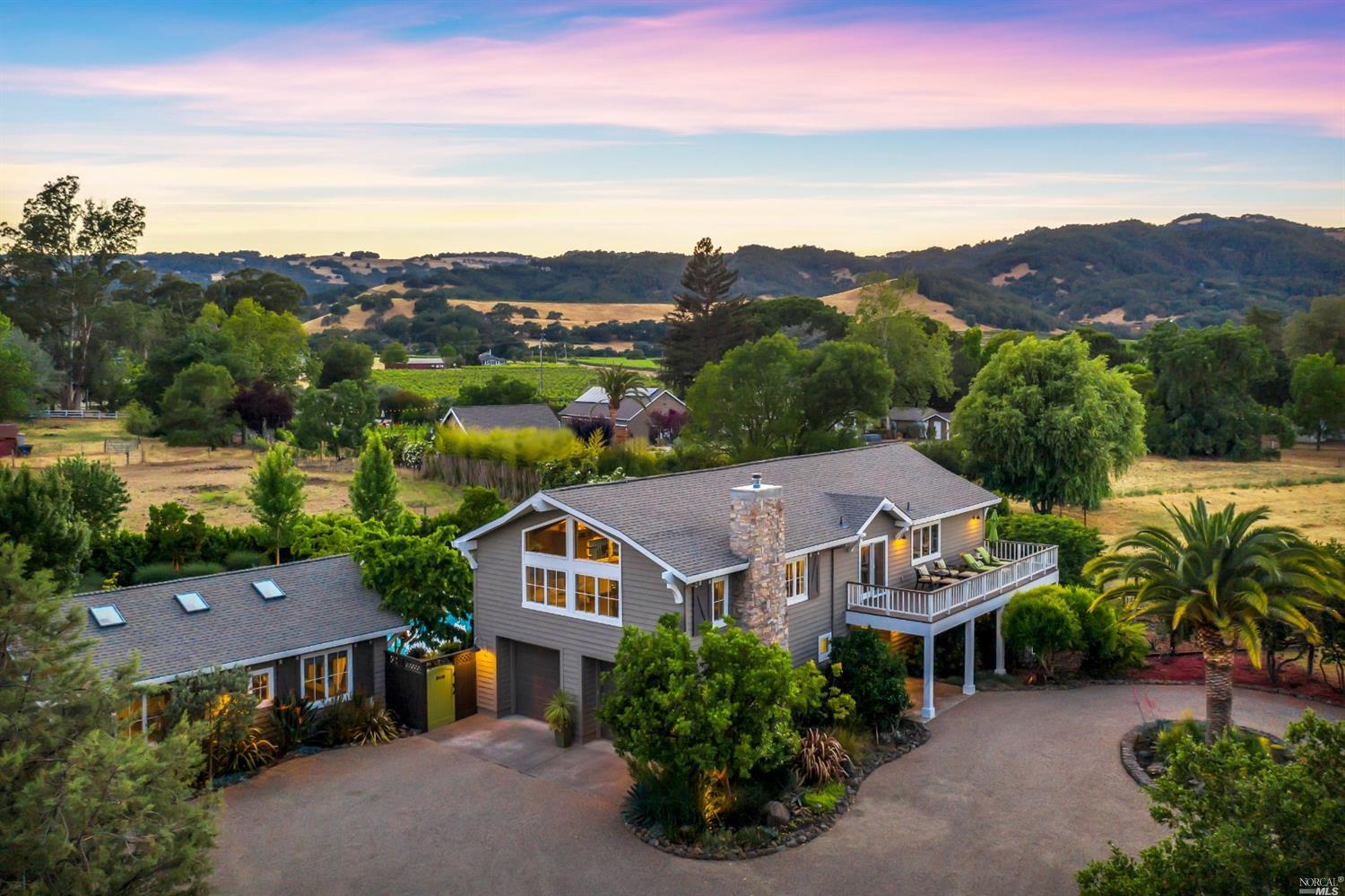 an aerial view of a house with a garden
