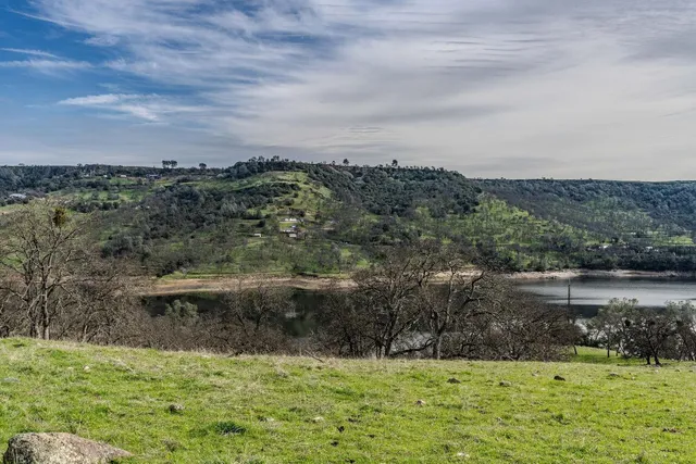 a view of a lake with a yard