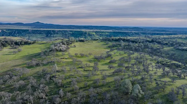 a view of lake with city and mountain view