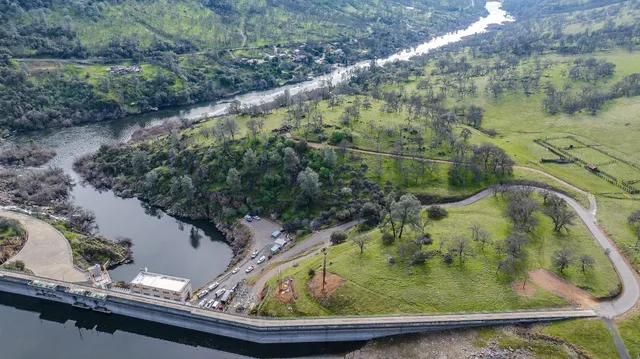 a view of swimming pool from a lake view