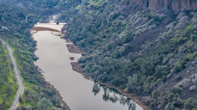 a view of a lake with a yard