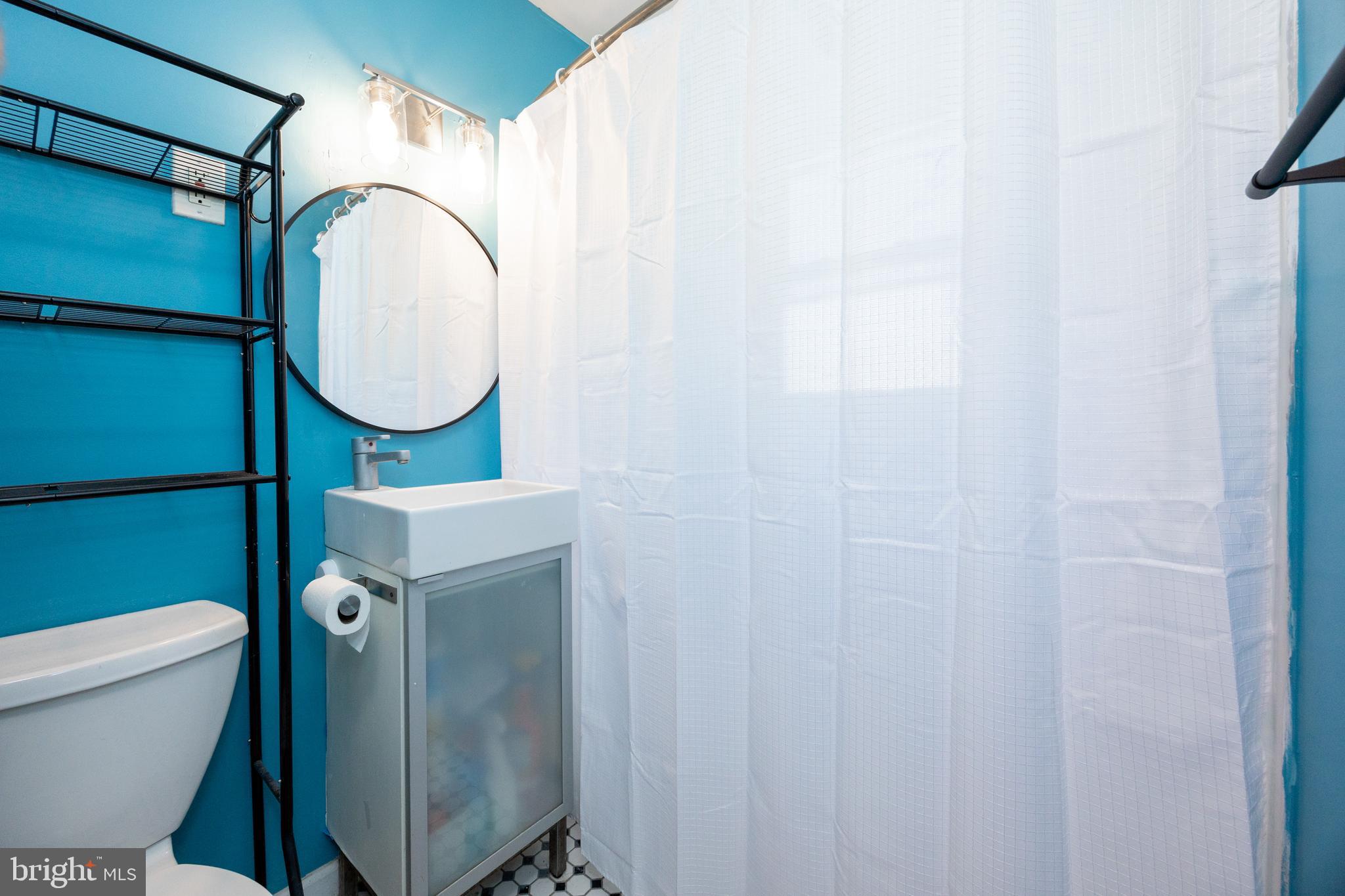 2405 Line Lexington Road Hatfield, PA 19440 - Photo 19 of 31 a bathroom with a toilet and a mirror