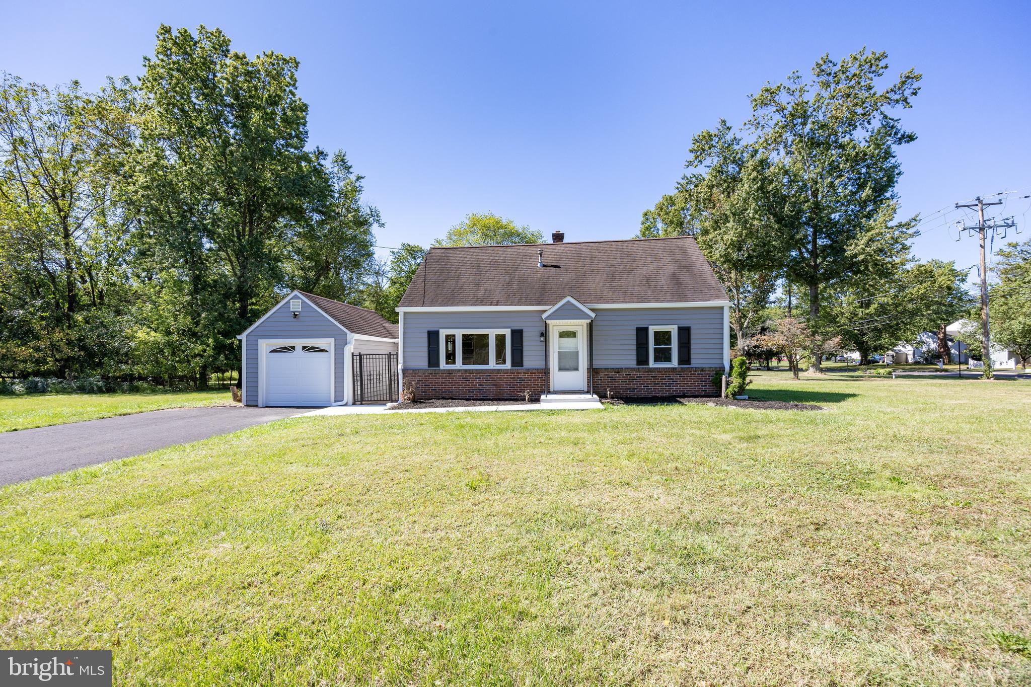 2405 Line Lexington Road Hatfield, PA 19440 - Photo 3 of 31 a front view of a house with a garden and tree