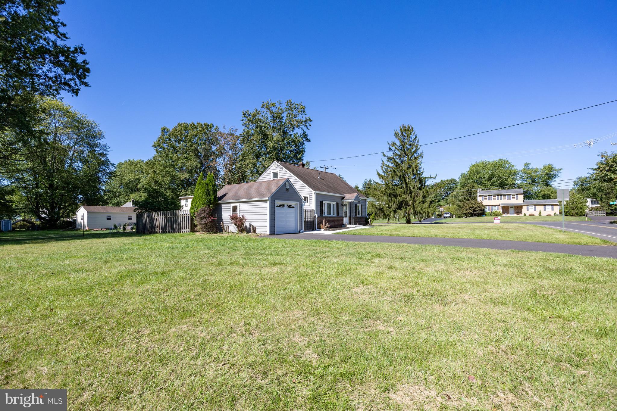 2405 Line Lexington Road Hatfield, PA 19440 - Photo 6 of 31 a front view of a house with a yard and trees