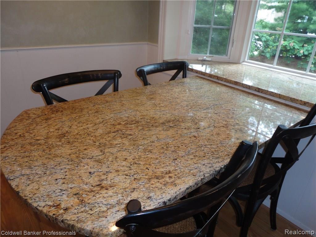 1796 East Maple Road Birmingham, MI 48009 - Photo 11 of 27 Granite Top Table and chairs are inclusive of the sale of the home,