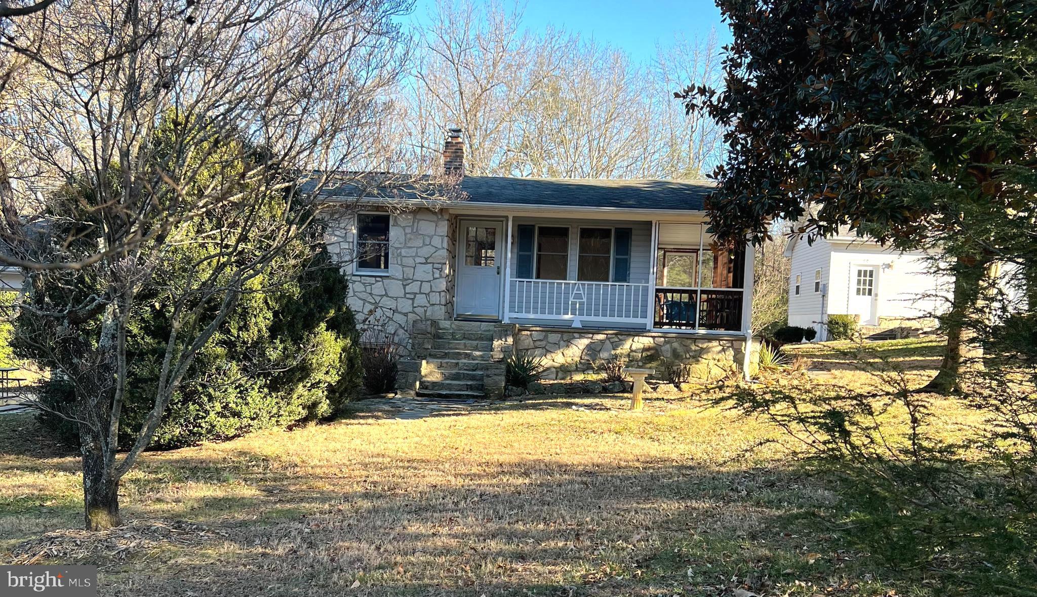 52 Salvington Road Fredericksburg, VA 22405 - Photo 1 of 34 a front view of a house with a yard