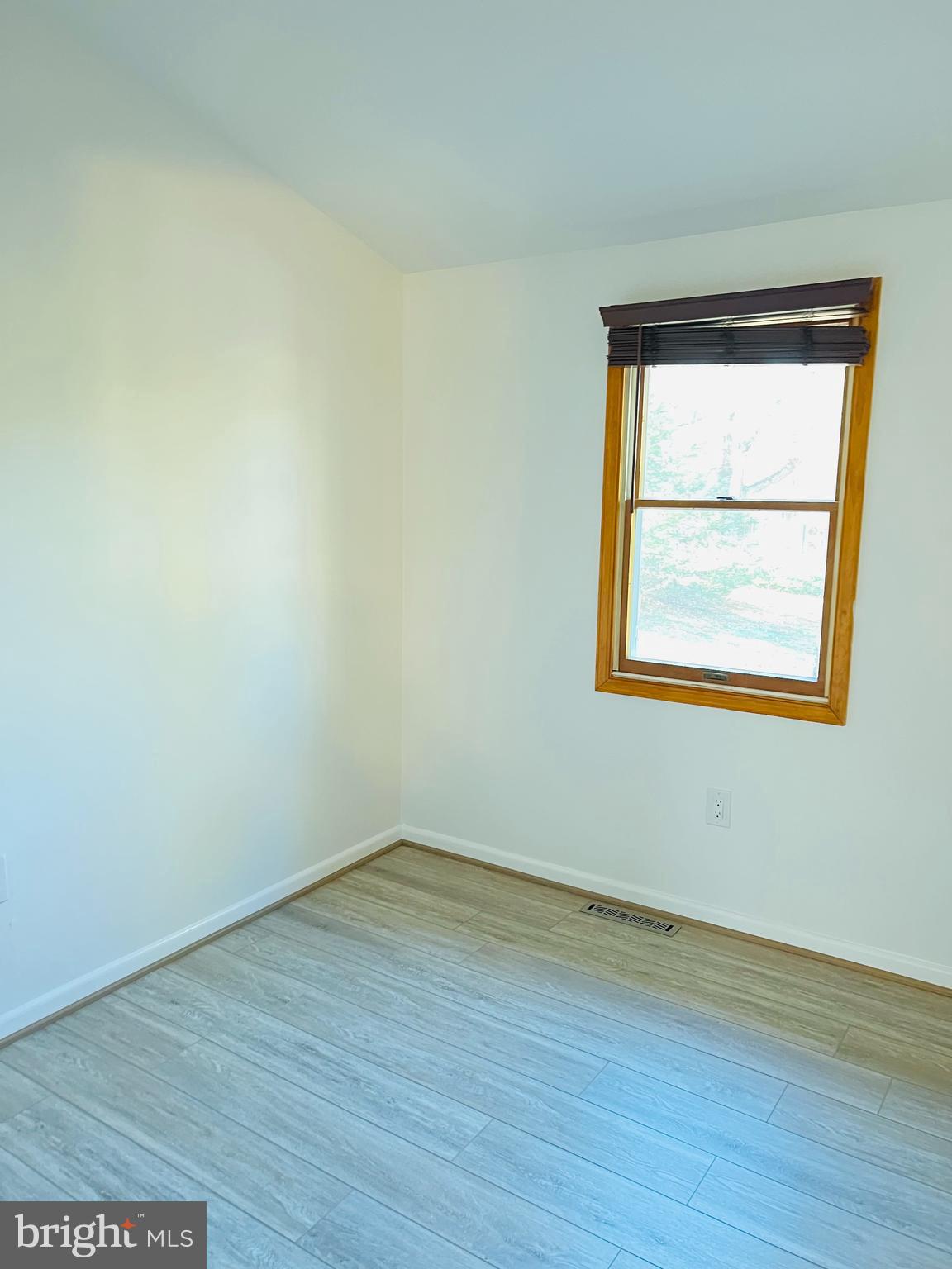 52 Salvington Road Fredericksburg, VA 22405 - Photo 15 of 34 wooden floor in an empty room with a window