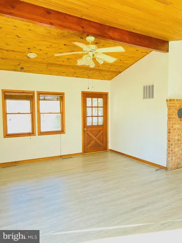 a view of a kitchen with wooden floor