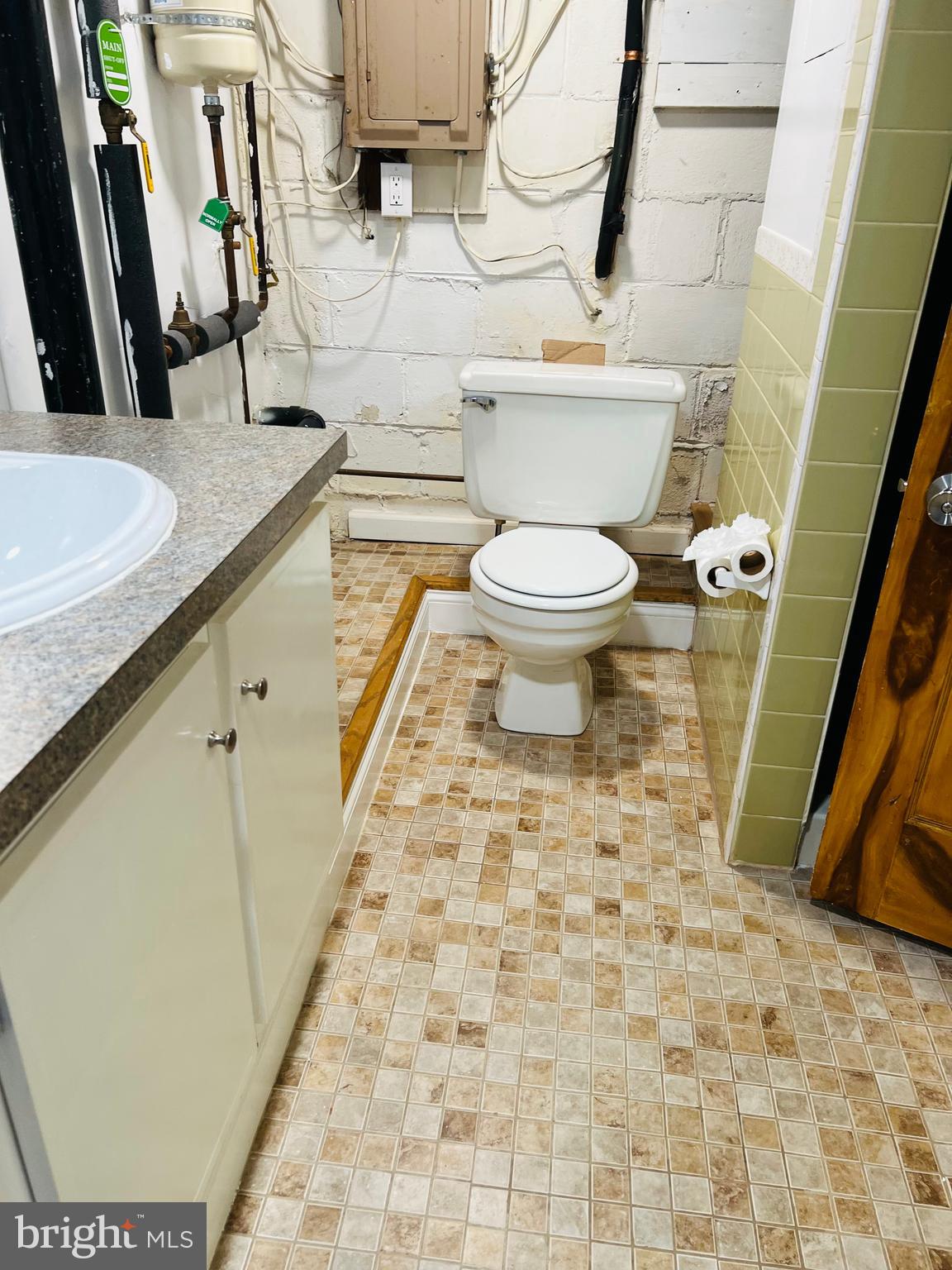 52 Salvington Road Fredericksburg, VA 22405 - Photo 30 of 34 a bathroom with a sink a toilet and a mirror