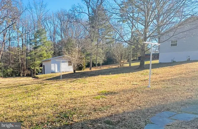 a house with yard covered with trees