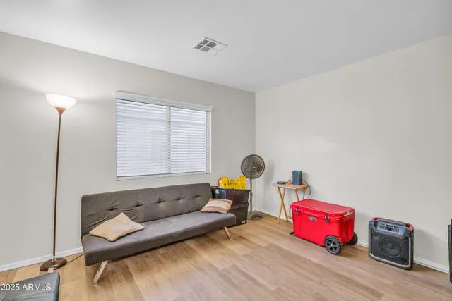 a living room with furniture and a window