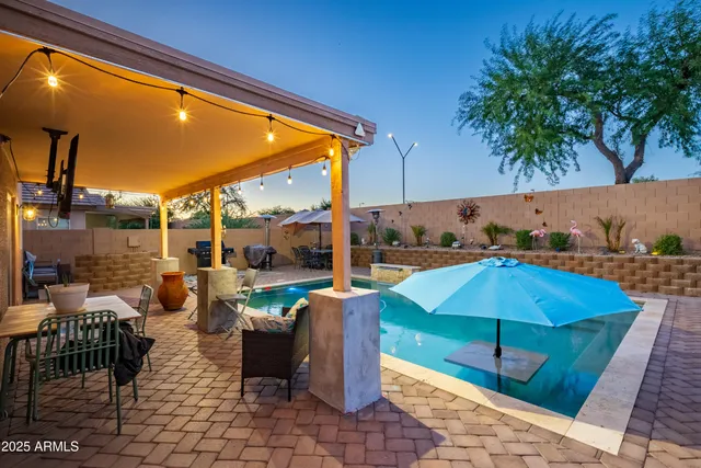 a view of balcony with chairs and umbrella