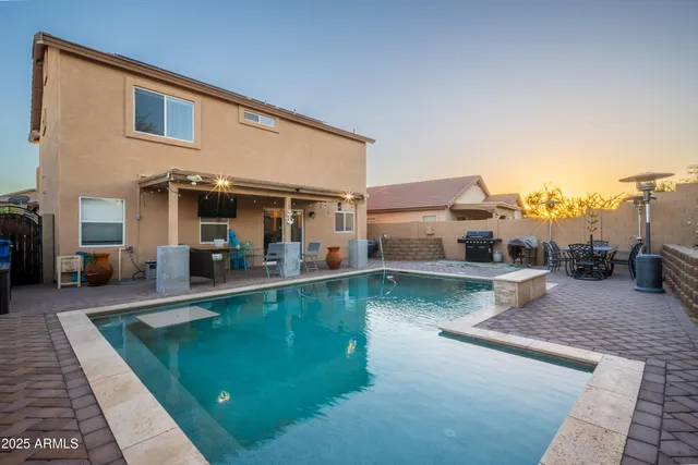 a swimming pool view with a outdoor seating space
