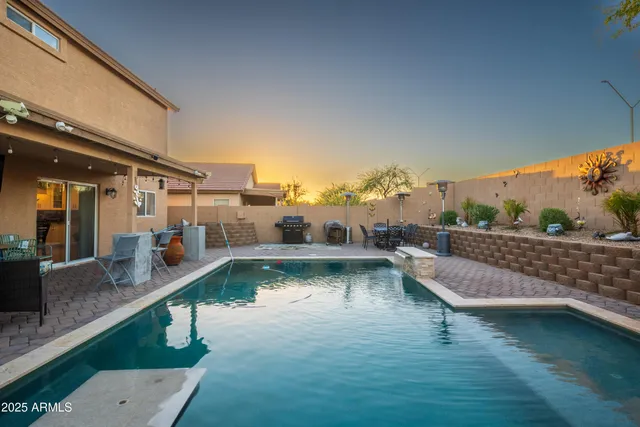 a view of swimming pool with outdoor seating