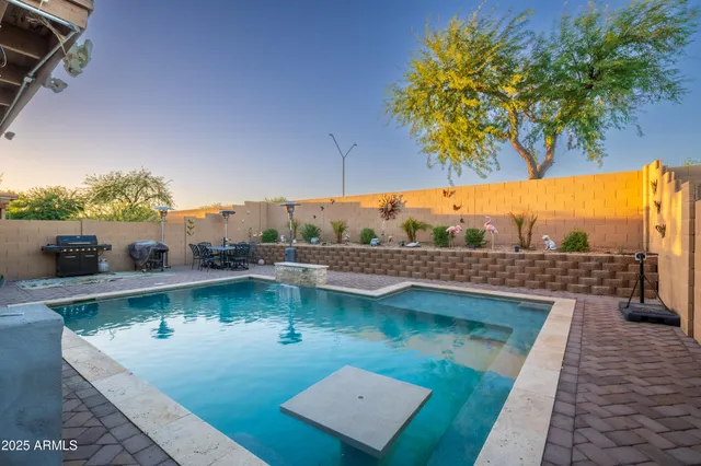 a view of a swimming pool with a patio