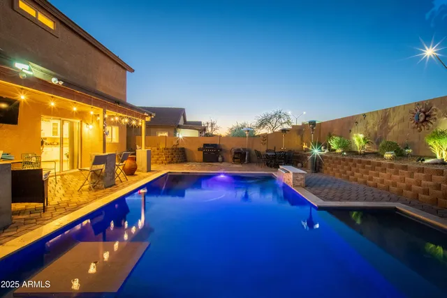 a view of swimming pool with outdoor seating