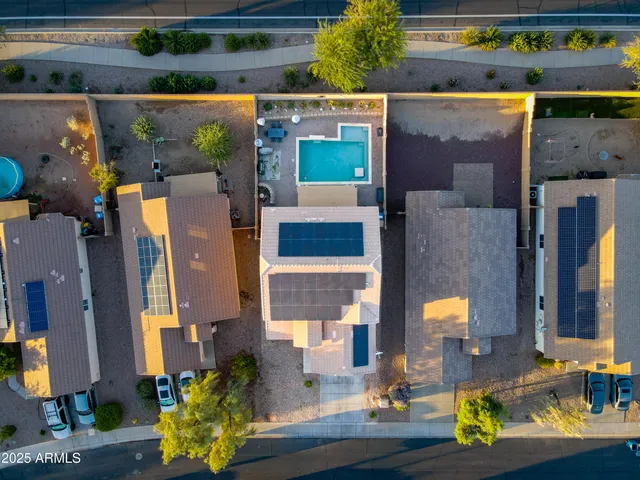 an aerial view of residential houses with outdoor space