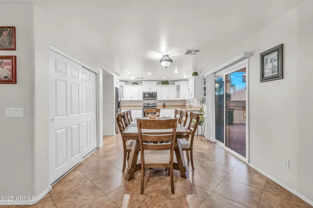 a dining room with furniture and window