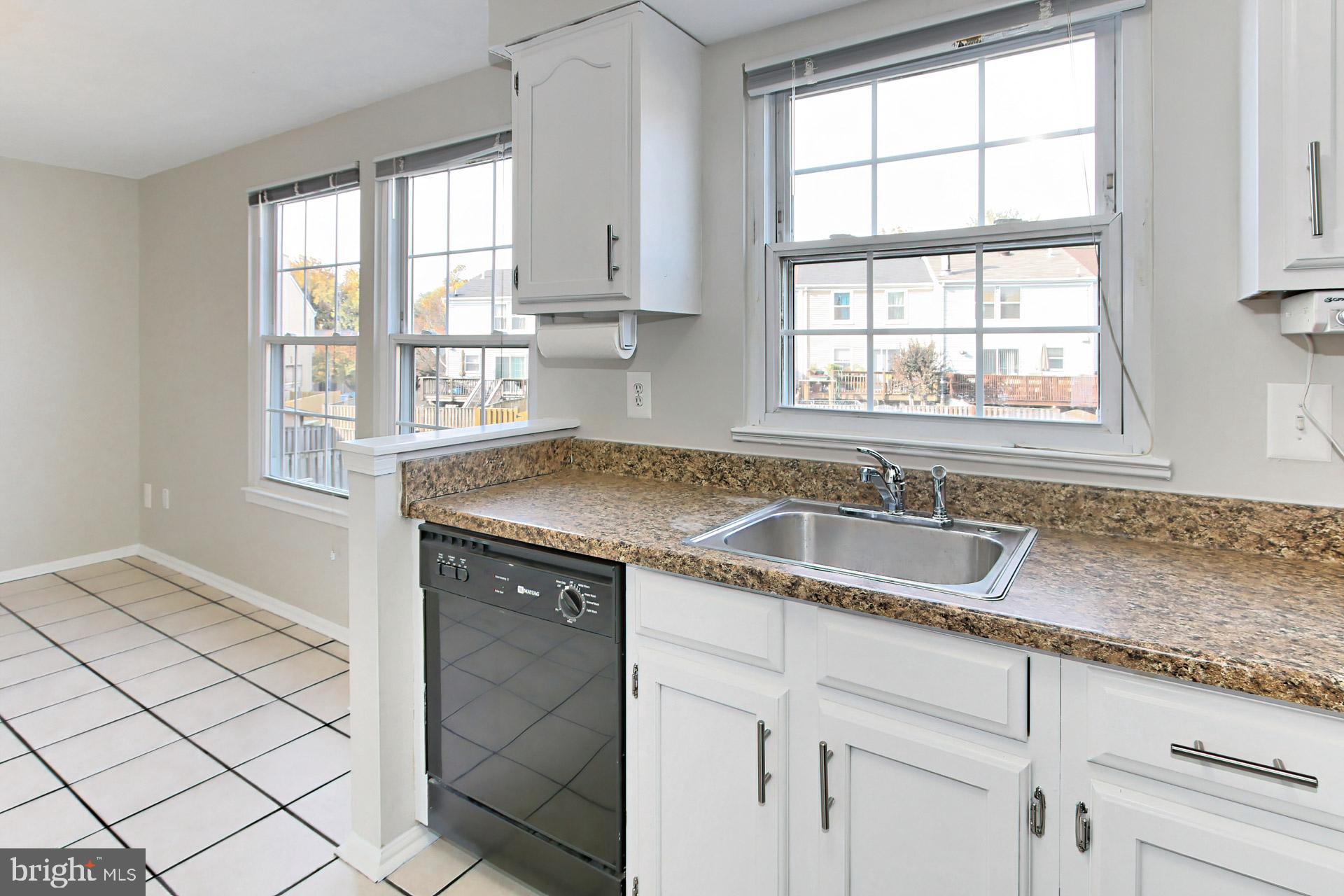 7406 Aspenpark Road Lorton, VA 22079 - Photo 9 of 33 Sunny kitchen - w/ 3 large windows
