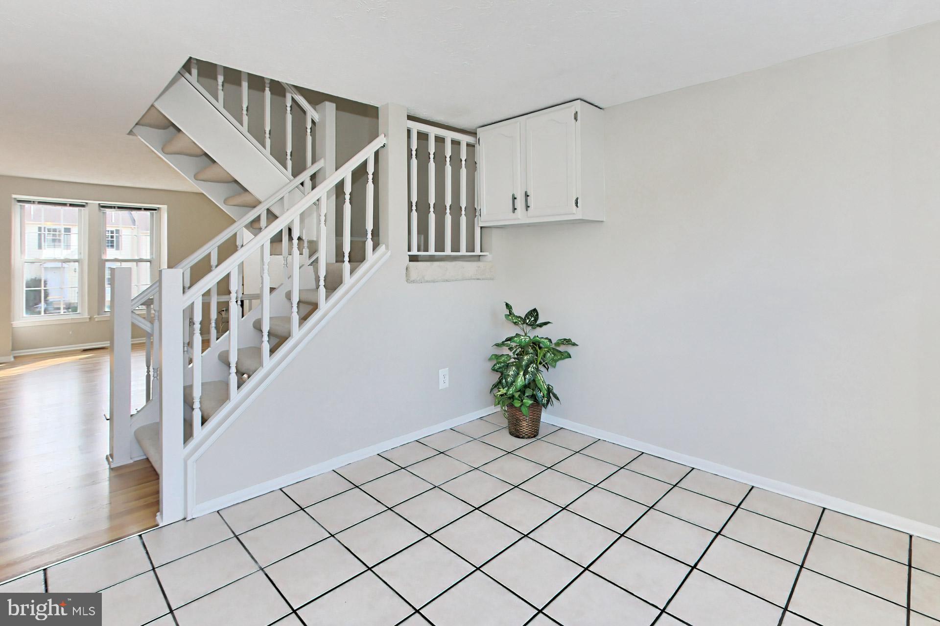 7406 Aspenpark Road Lorton, VA 22079 - Photo 12 of 33 Main level stairs to upper and lower levels