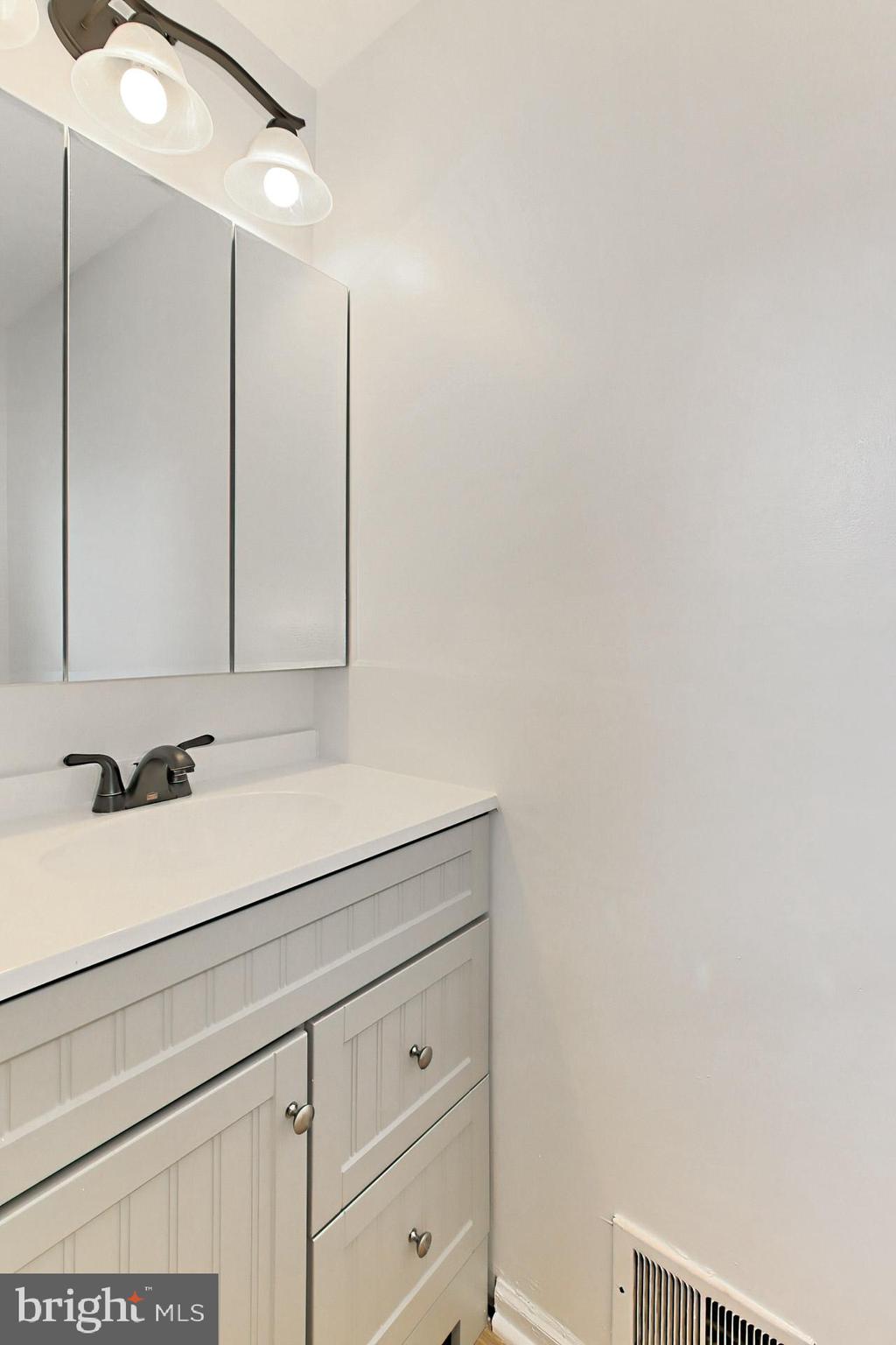 7406 Aspenpark Road Lorton, VA 22079 - Photo 13 of 33 New bathroom fixtures - each of 2.5 baths