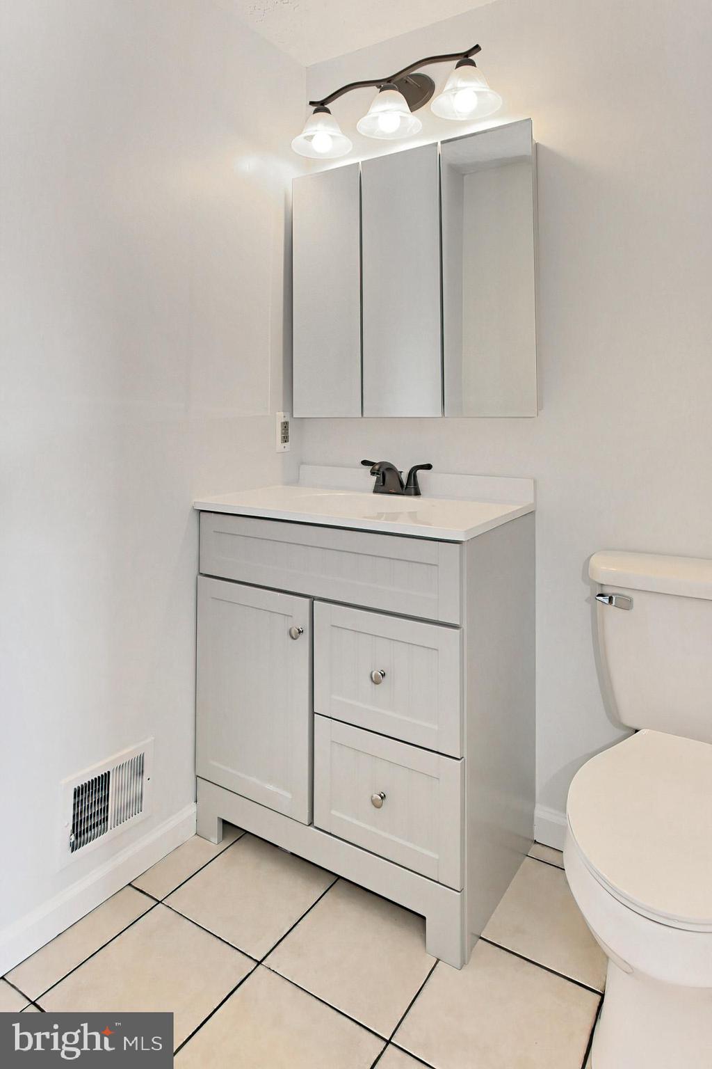 7406 Aspenpark Road Lorton, VA 22079 - Photo 14 of 33 New light fixtures and vanities