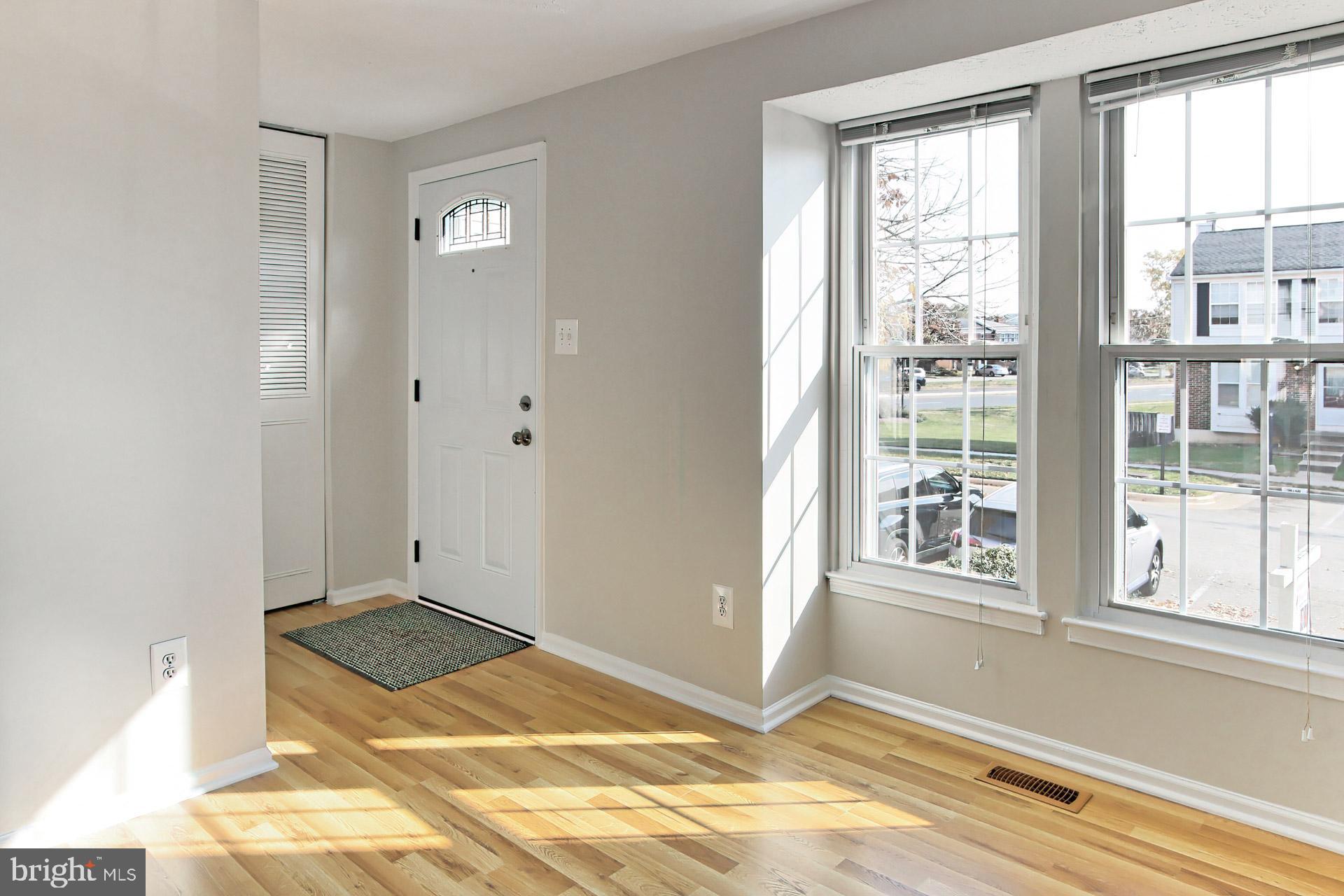 7406 Aspenpark Road Lorton, VA 22079 - Photo 2 of 33 Bright living rm w/ new wood laminate in LR and DR