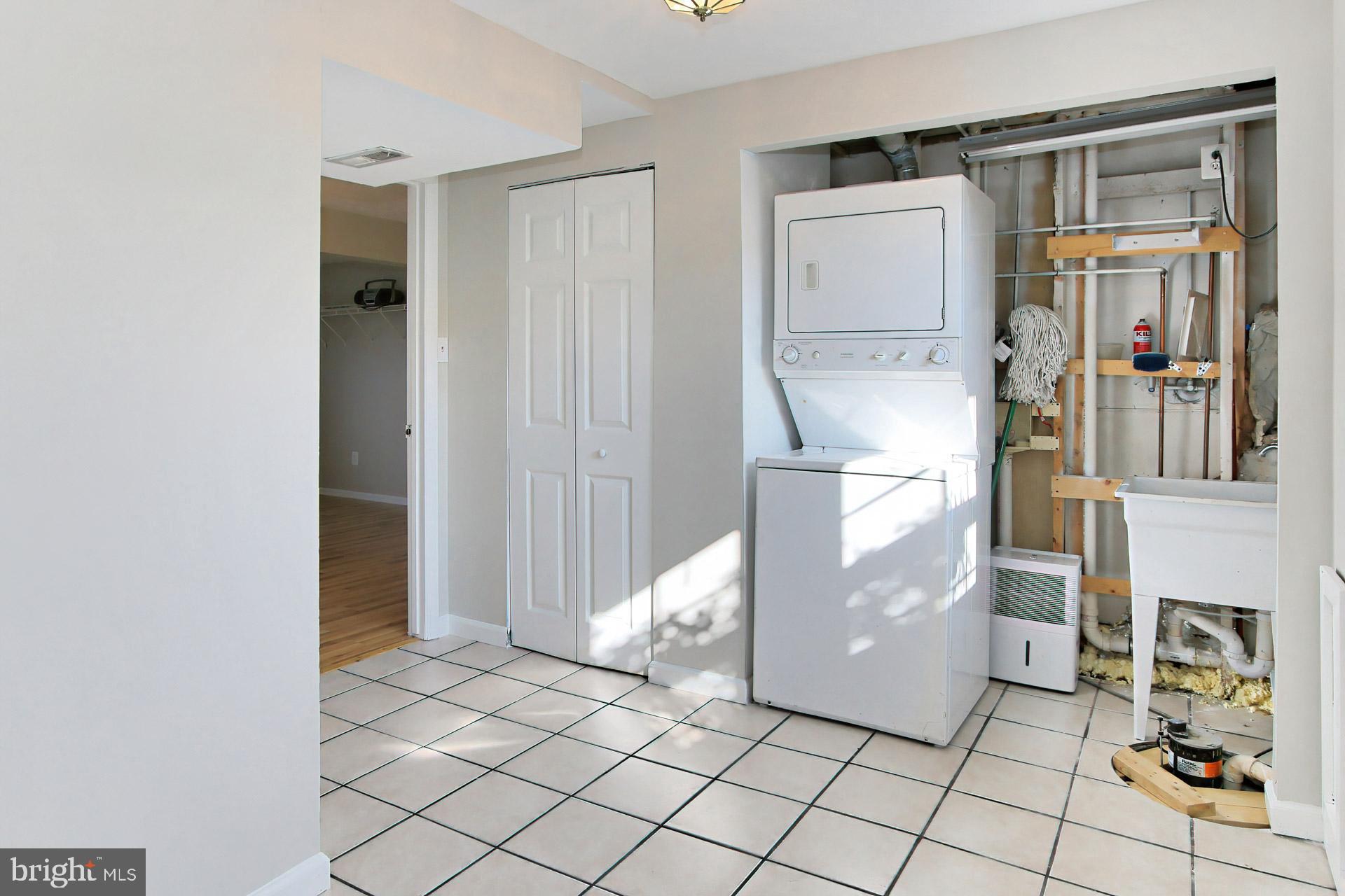 7406 Aspenpark Road Lorton, VA 22079 - Photo 26 of 33 Stacked washer/dryer + surplus area
