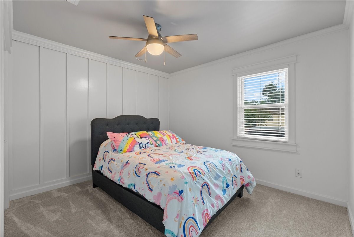 1572 Silverpines Road, Unit 572 Houston, TX 77062 - Photo 23 of 37 A charming board and batten wall adds a tasteful focal point in the second bedroom.