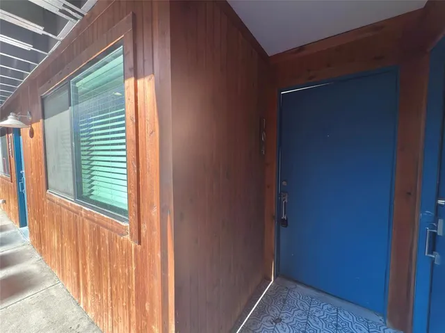 a view of a porch with a table and chair