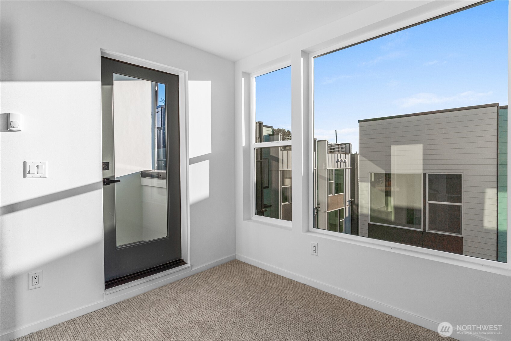 3510 Northeast 125th Street, Unit F Seattle, WA 98125 - Photo 23 of 24 a view of a hallway with windows