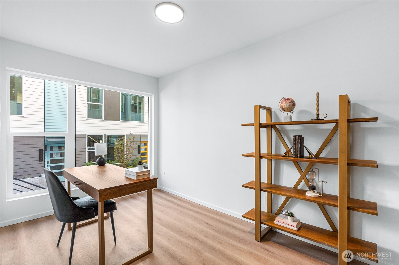 3510 Northeast 125th Street, Unit F Seattle, WA 98125 - Photo 4 of 24 a view of a workspace with furniture and a window