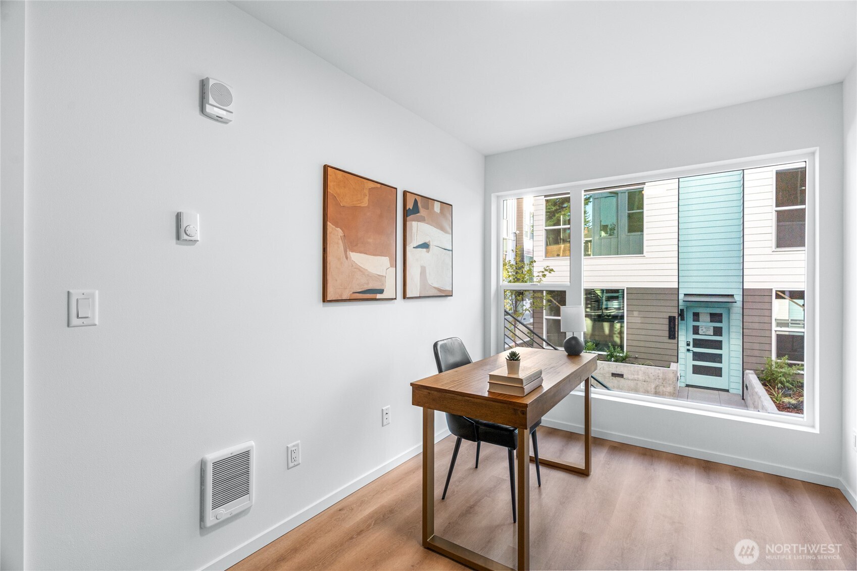 3510 Northeast 125th Street, Unit F Seattle, WA 98125 - Photo 5 of 24 a workspace with wooden floor and a window