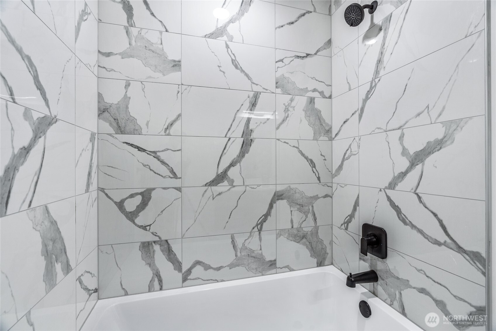 3510 Northeast 125th Street, Unit F Seattle, WA 98125 - Photo 8 of 24 a bathroom with a bathtub