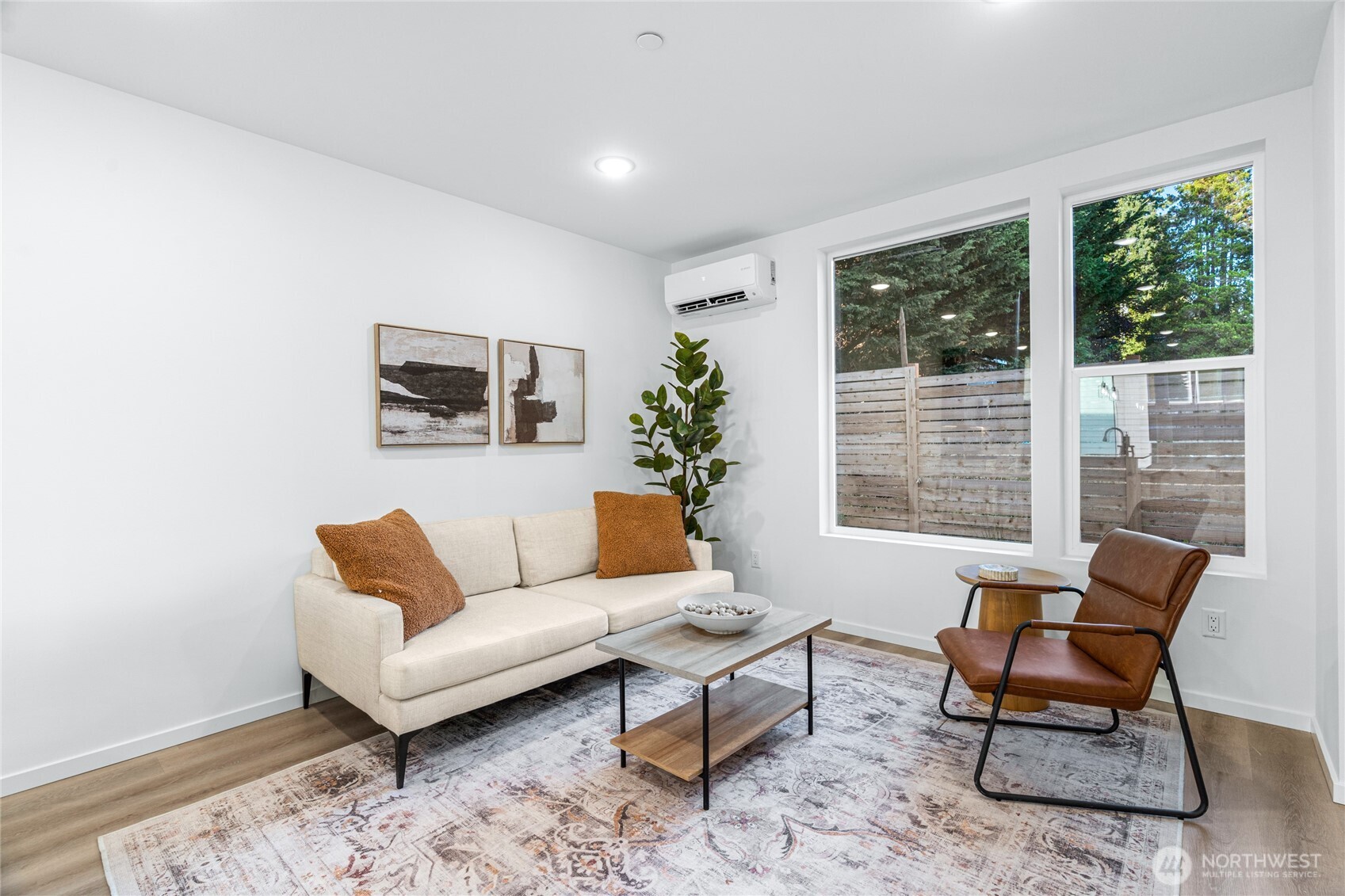 3510 Northeast 125th Street, Unit F Seattle, WA 98125 - Photo 9 of 24 a living room with furniture and a potted plant
