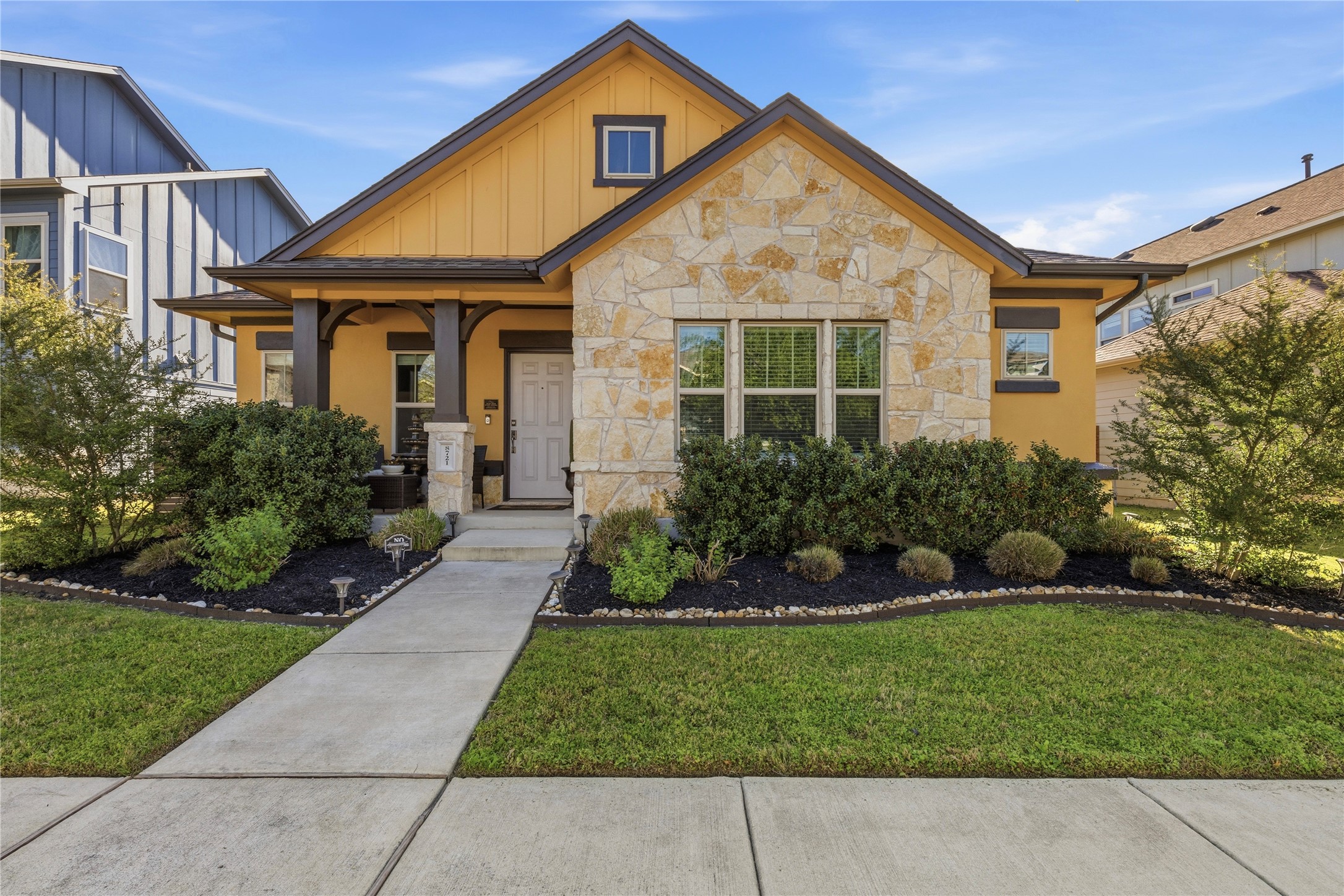 8721 Sikes Way Austin, TX 78747 - Photo 1 of 37 a front view of a house with a yard