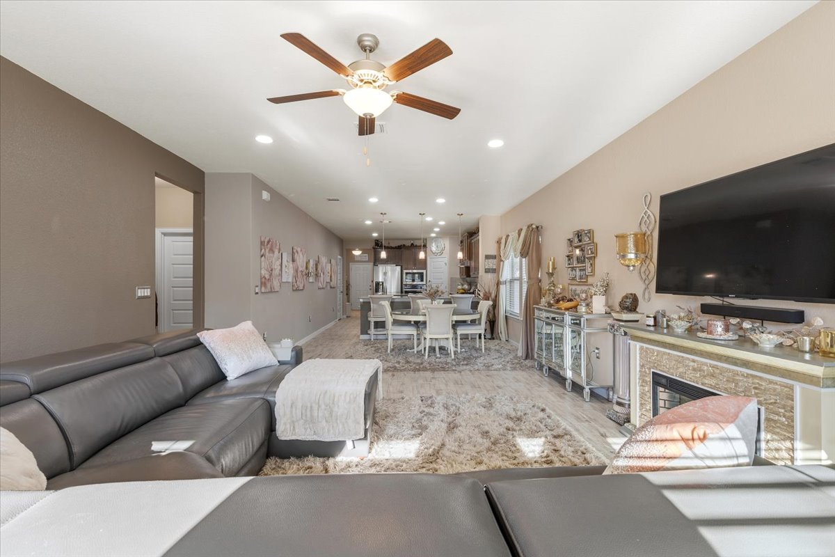 8721 Sikes Way Austin, TX 78747 - Photo 12 of 37 a living room with furniture and a flat screen tv