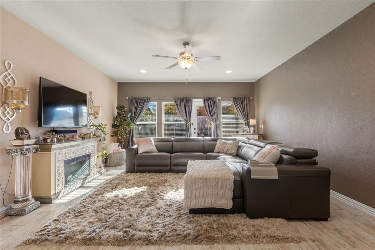 8721 Sikes Way Austin, TX 78747 - Photo 13 of 37 a living room with furniture and a flat screen tv