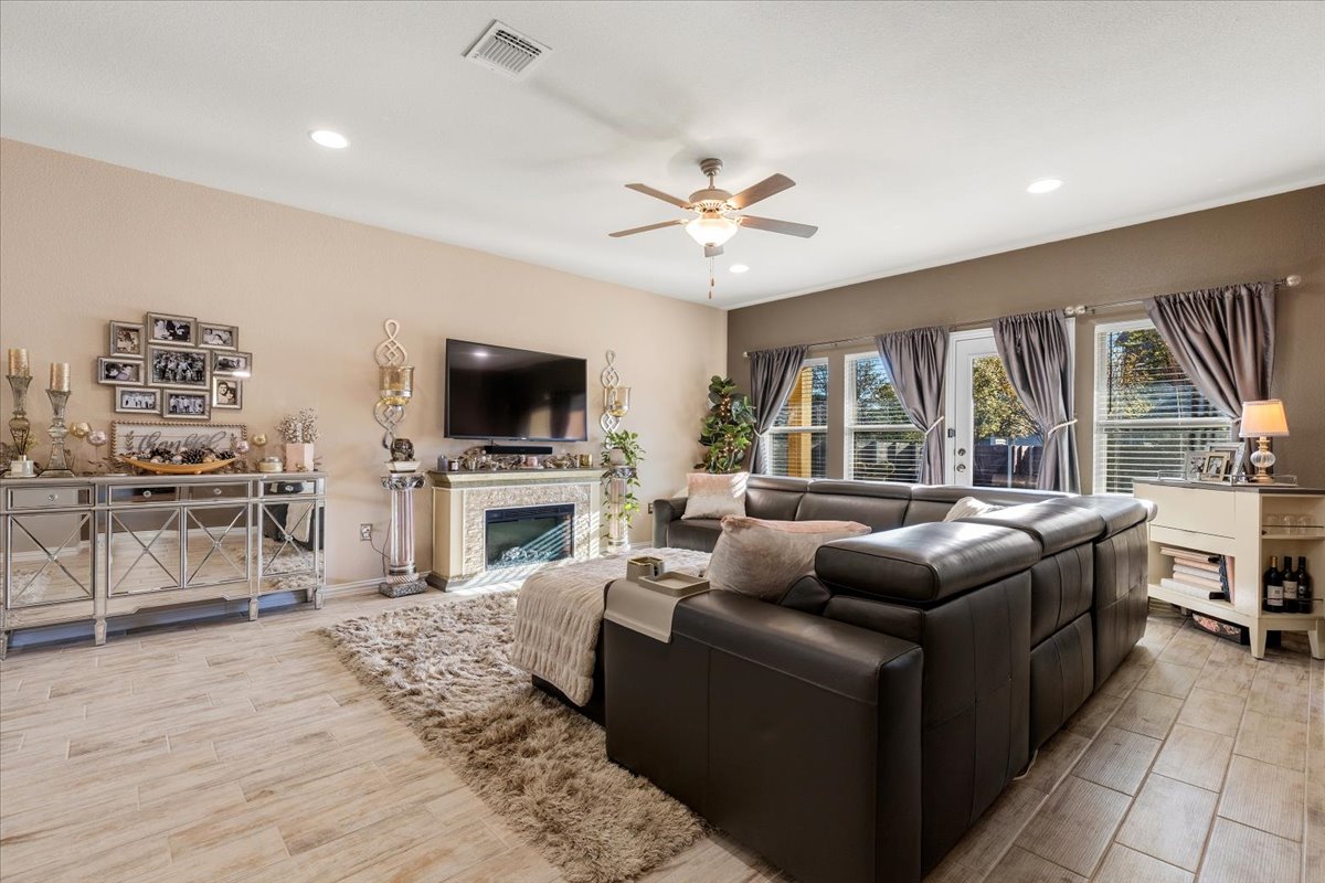 8721 Sikes Way Austin, TX 78747 - Photo 14 of 37 a living room with furniture and a flat screen tv