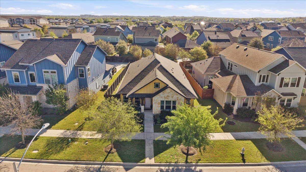 8721 Sikes Way Austin, TX 78747 - Photo 2 of 37 an aerial view of a residential apartment building with a yard