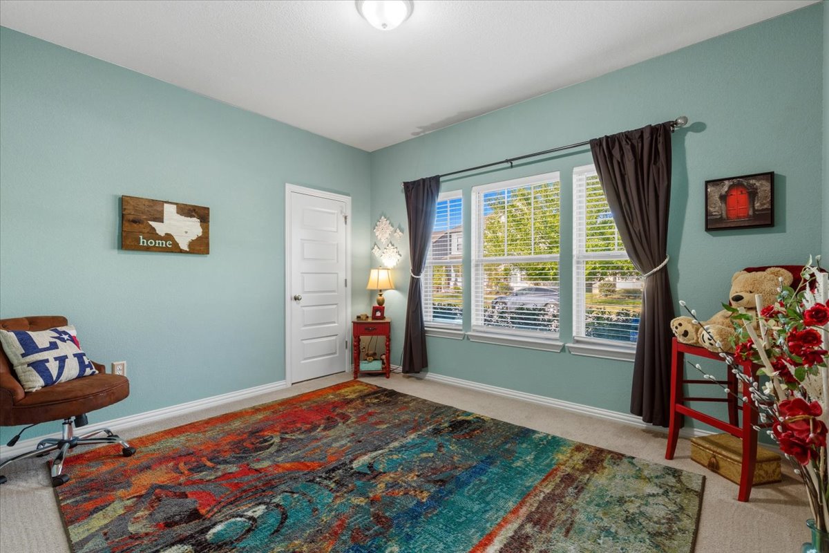 8721 Sikes Way Austin, TX 78747 - Photo 26 of 37 a bedroom with a bed and a window