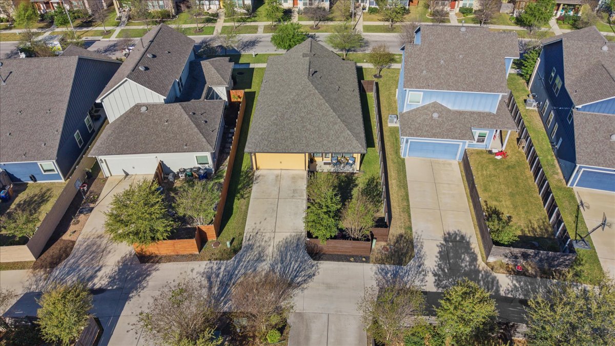 8721 Sikes Way Austin, TX 78747 - Photo 34 of 37 an aerial view of multiple houses with outdoor space