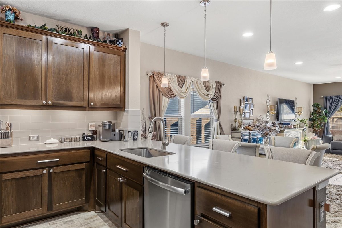 8721 Sikes Way Austin, TX 78747 - Photo 36 of 37 a kitchen with lots of counter space and a sink