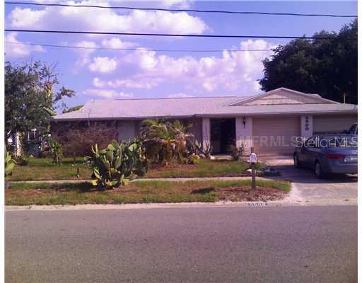5600 Riddle Road Holiday, FL 34690 - Photo 1 of 1 Exterior Front - Wide 90 foot lot with 2 car garage and extra wide driveway. More parking on side of house.