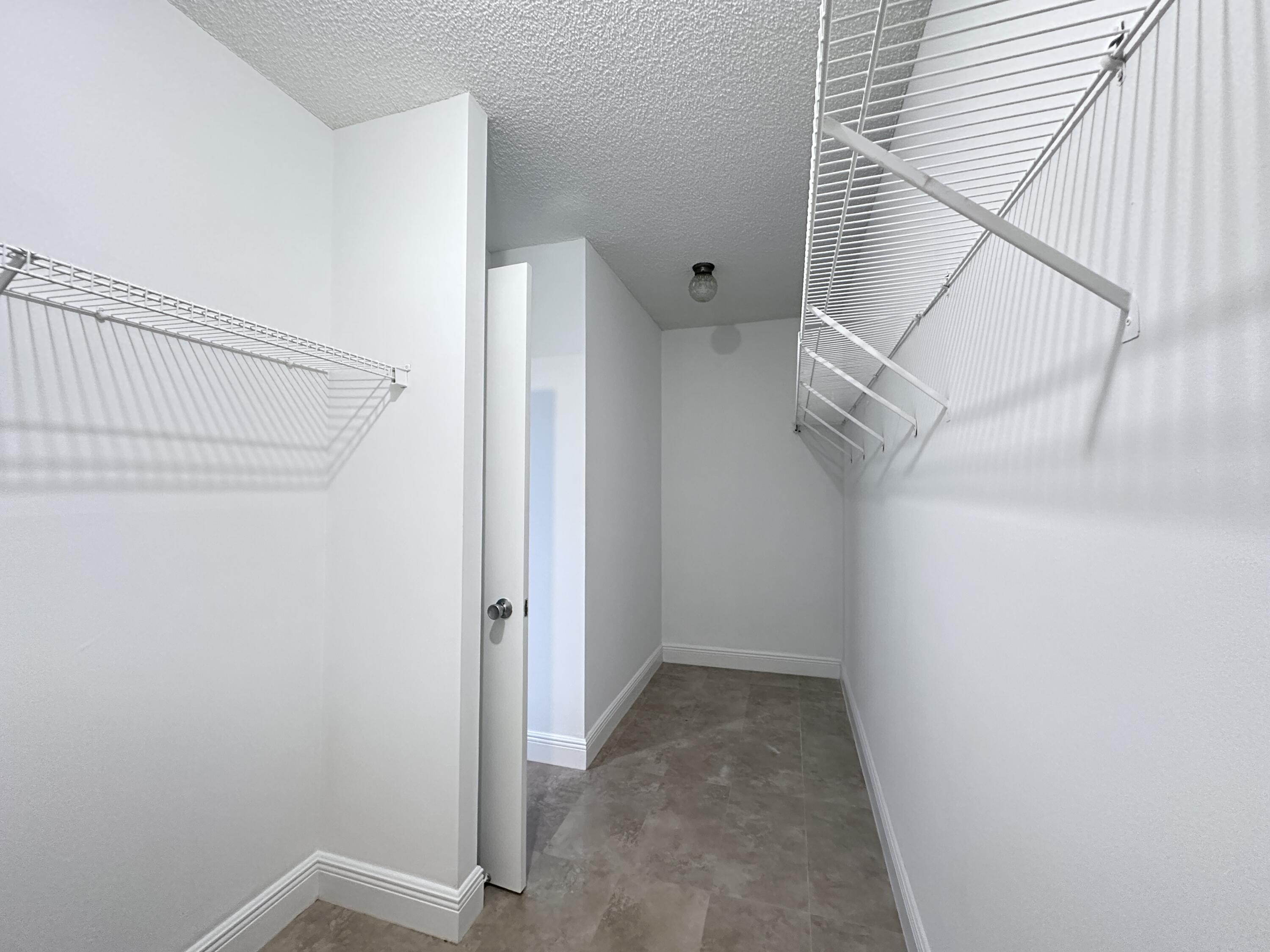 10777 West Sample Road, Unit 714 Coral Springs, FL 33065 - Photo 11 of 19 Master Walk-in closet