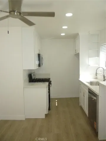 a view of a bathroom with a glass shower door