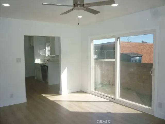 en empty room with a fan