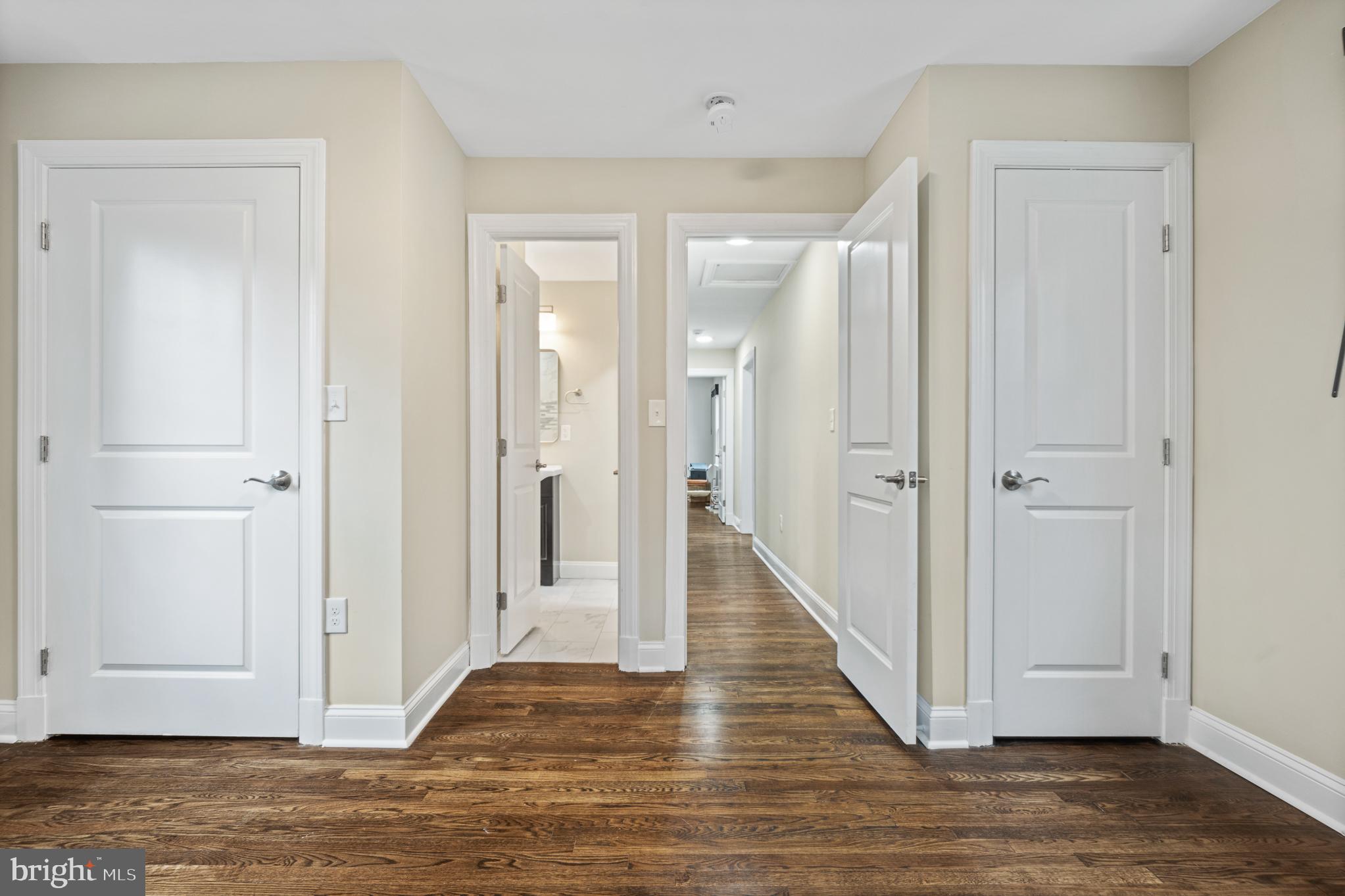 9217 Fowler Lane Lanham, MD 20706 - Photo 39 of 80 a view of a hallway with wooden floor